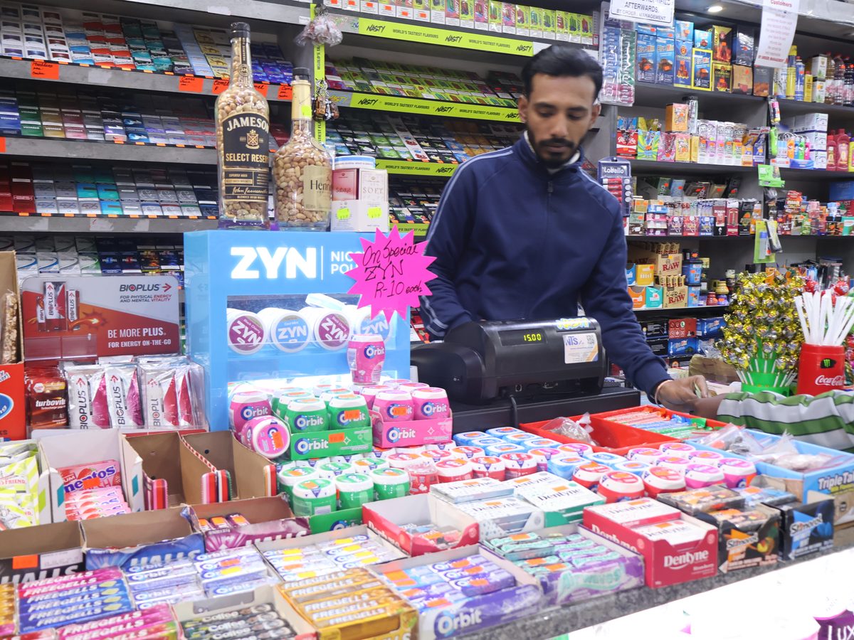 Friendly staff behind the counter at Rhodes Park Supermarket