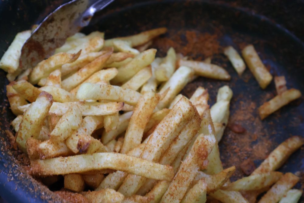 Close-up of freshly cooked spiced chips